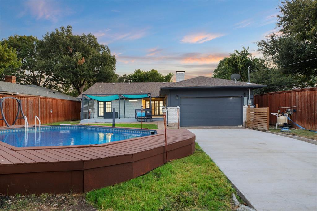 10922 Ferndale Road Dallas, TX 75238 - Photo 31 of 32 Pool at dusk featuring a patio