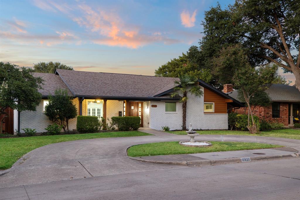 10922 Ferndale Road Dallas, TX 75238 - Photo 4 of 32 Single story home featuring brick siding, a yard, a porch, and a shingled roof