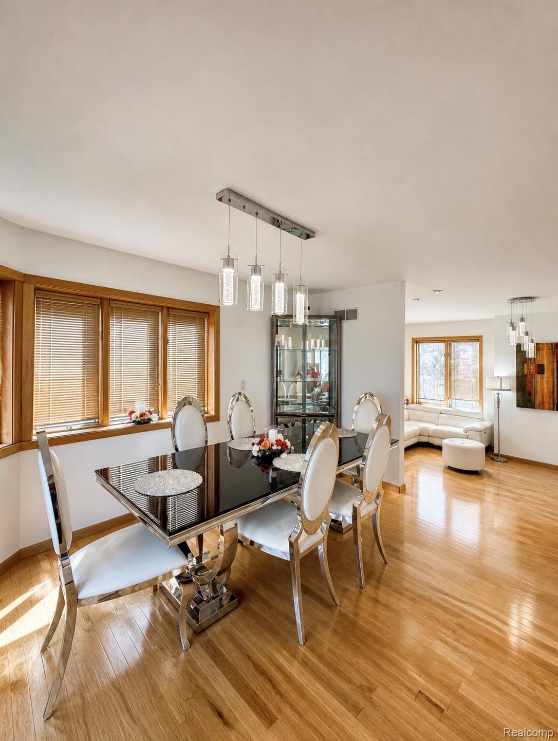 10655 Beardslee Road Perry, MI 48872 - Photo 6 of 26 Dining space with light wood-type flooring and hanging lights