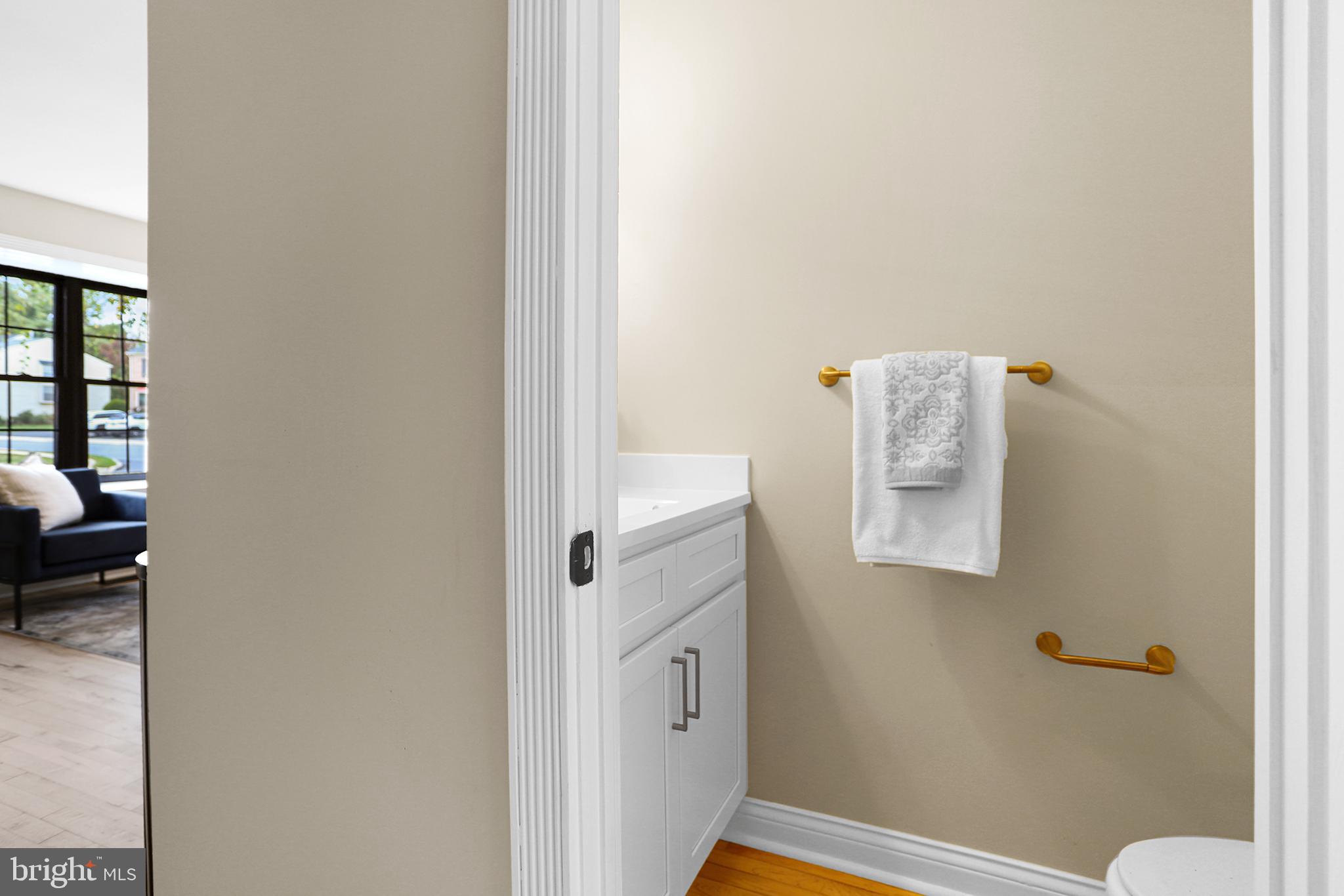524 Ward Road Brookhaven, PA 19015 - Photo 11 of 22 a bathroom with a sink and a mirror