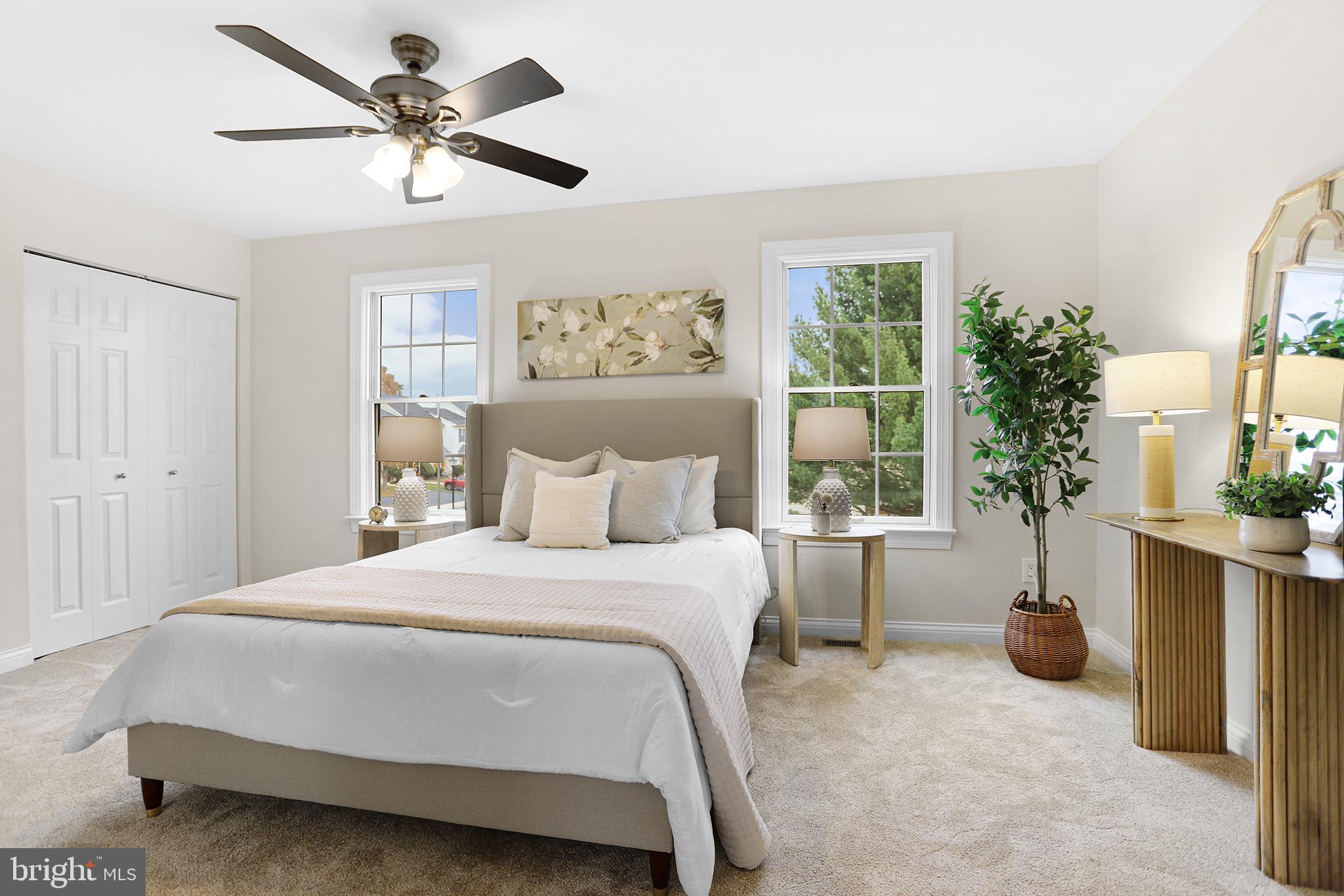 524 Ward Road Brookhaven, PA 19015 - Photo 12 of 22 a bedroom with a large bed a chandelier and a window