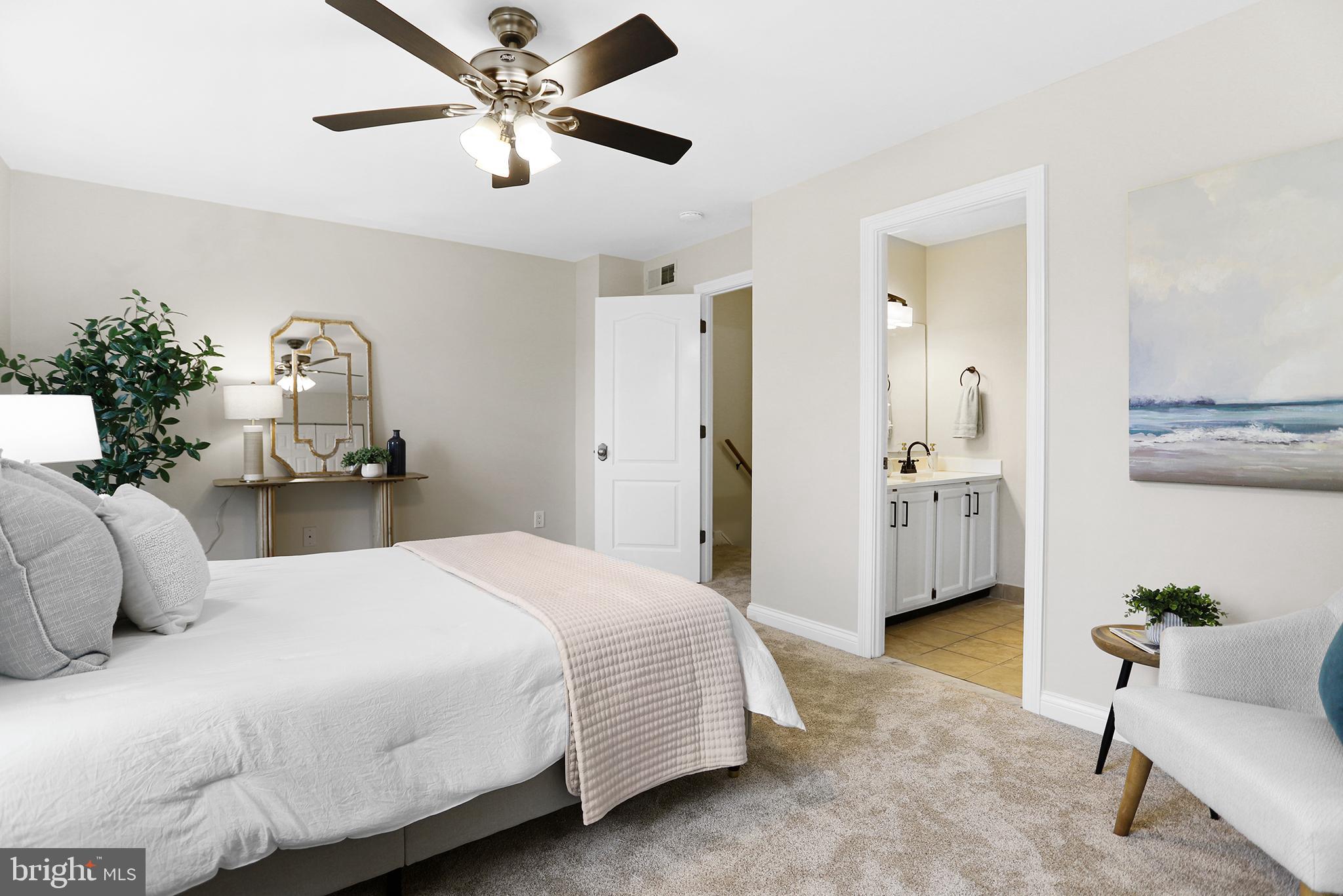 524 Ward Road Brookhaven, PA 19015 - Photo 13 of 22 a bedroom with a bed and a chandelier