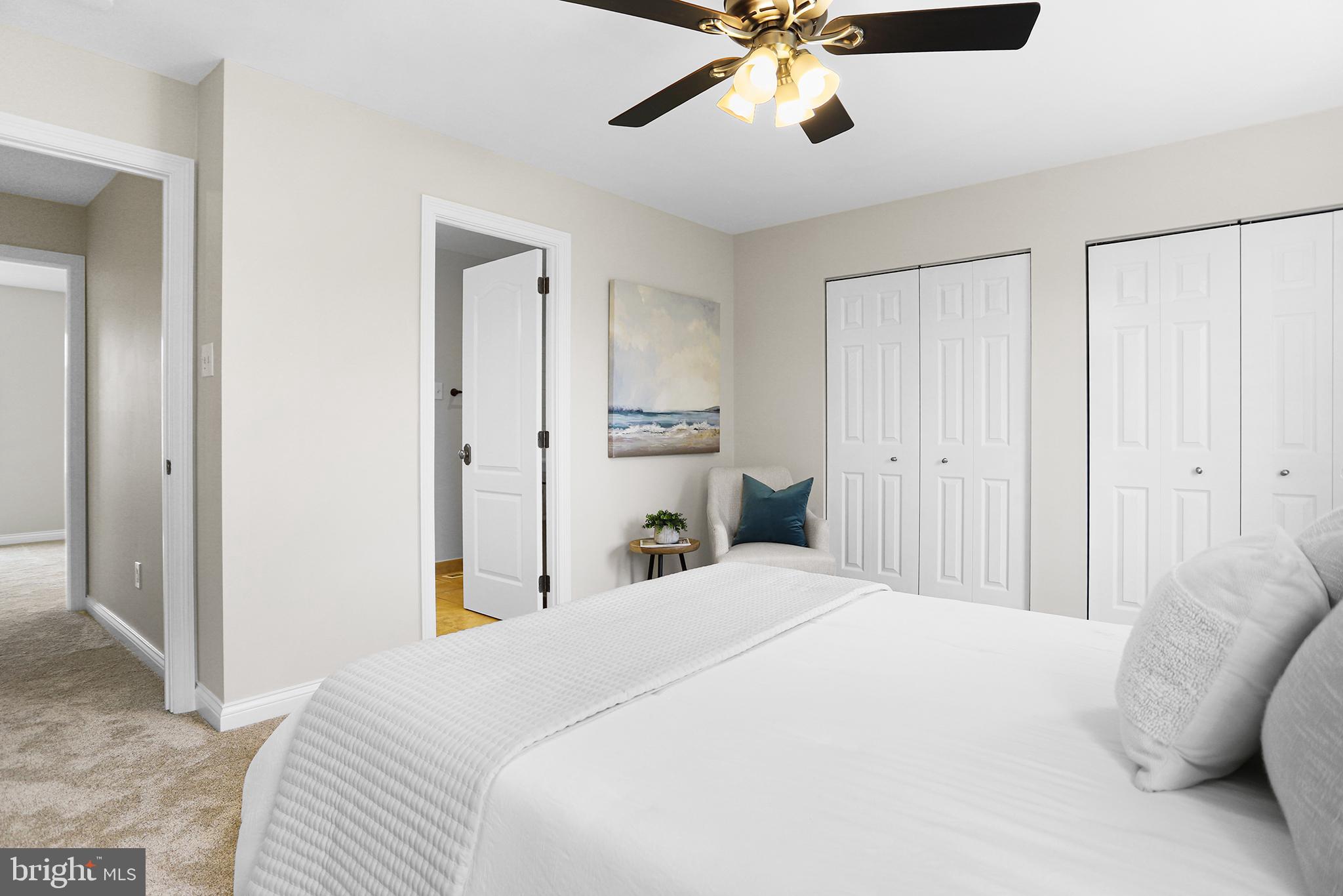 524 Ward Road Brookhaven, PA 19015 - Photo 14 of 22 a bedroom with a large bed and ceiling fan