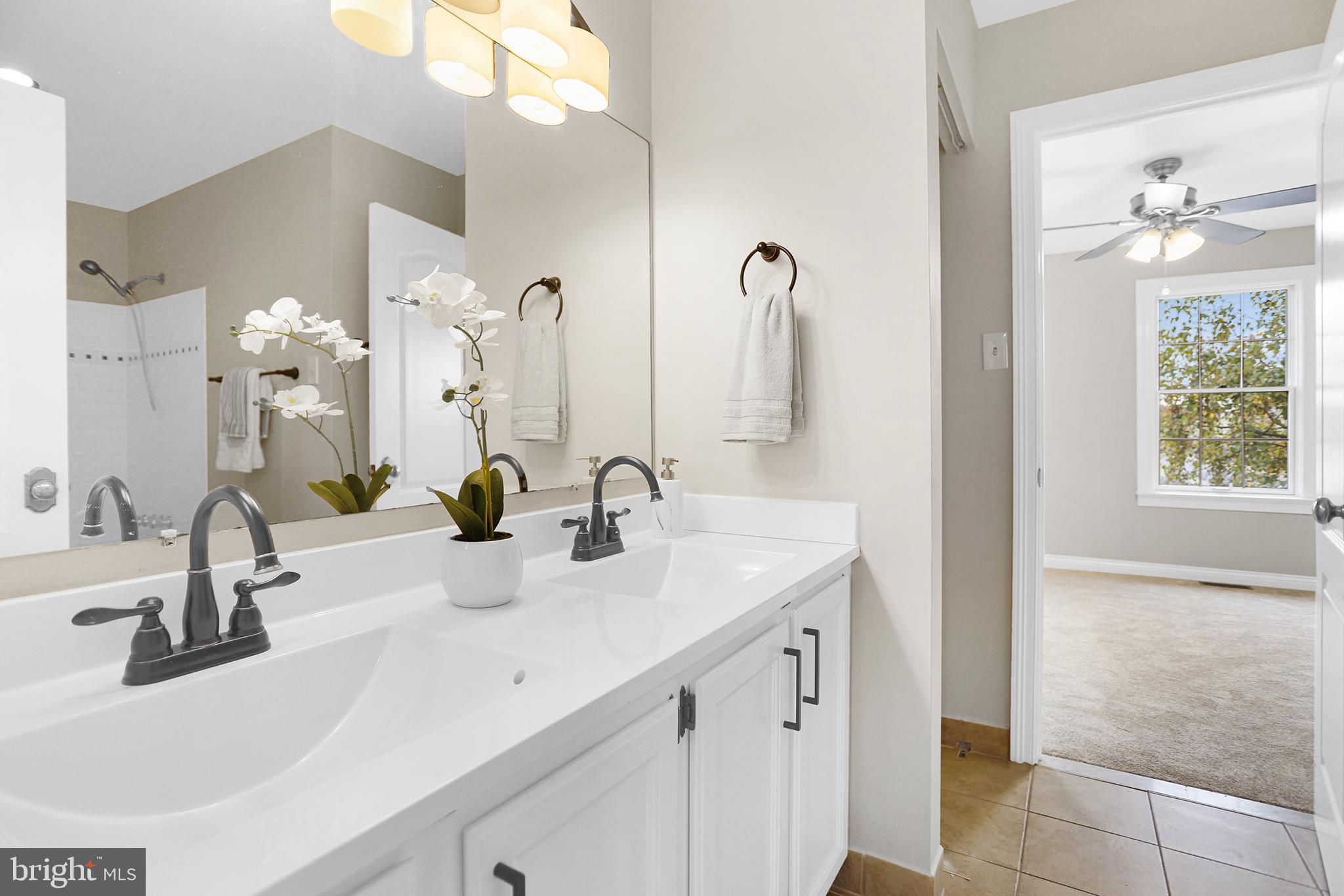 524 Ward Road Brookhaven, PA 19015 - Photo 15 of 22 a bathroom with a sink vanity and a mirror