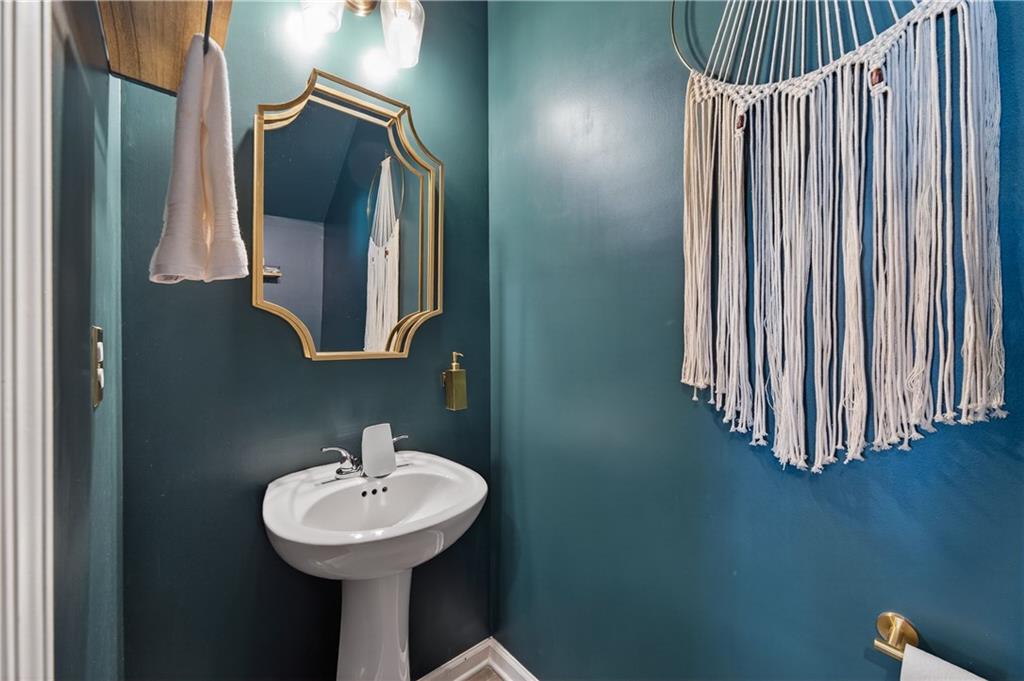 266 Shoals Bridge Road Acworth, GA 30102 - Photo 8 of 43 a bathroom with a sink a mirror and bathtub