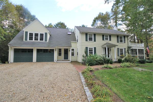 195 Conant Road Weston, MA 02493 - Photo 1 of 12 a front view of a house with a garden and yard