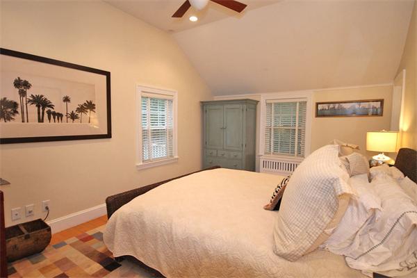 195 Conant Road Weston, MA 02493 - Photo 7 of 12 a bedroom with a bed and a painting on the wall