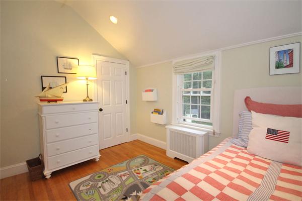 195 Conant Road Weston, MA 02493 - Photo 8 of 12 a bedroom with a bed and a window