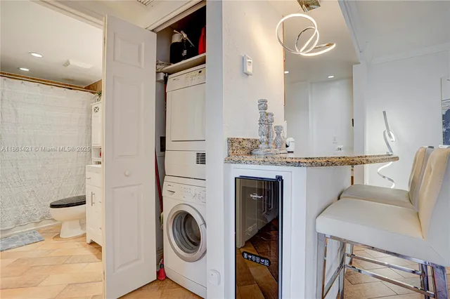 a bathroom with a sink vanity granite tub and shower