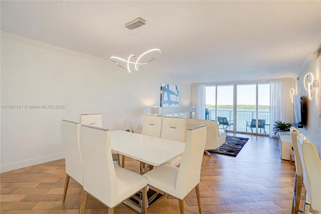 a large kitchen with a table and chairs in it