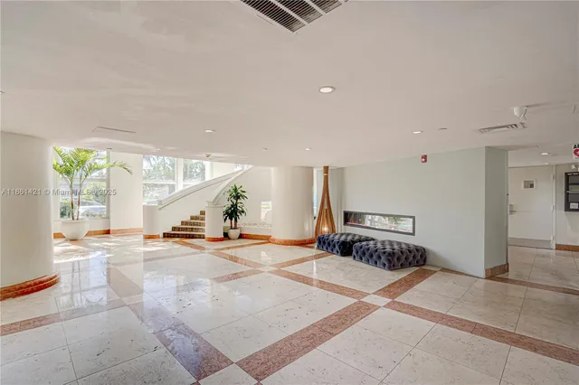 an aerial view of residential houses with outdoor space and river