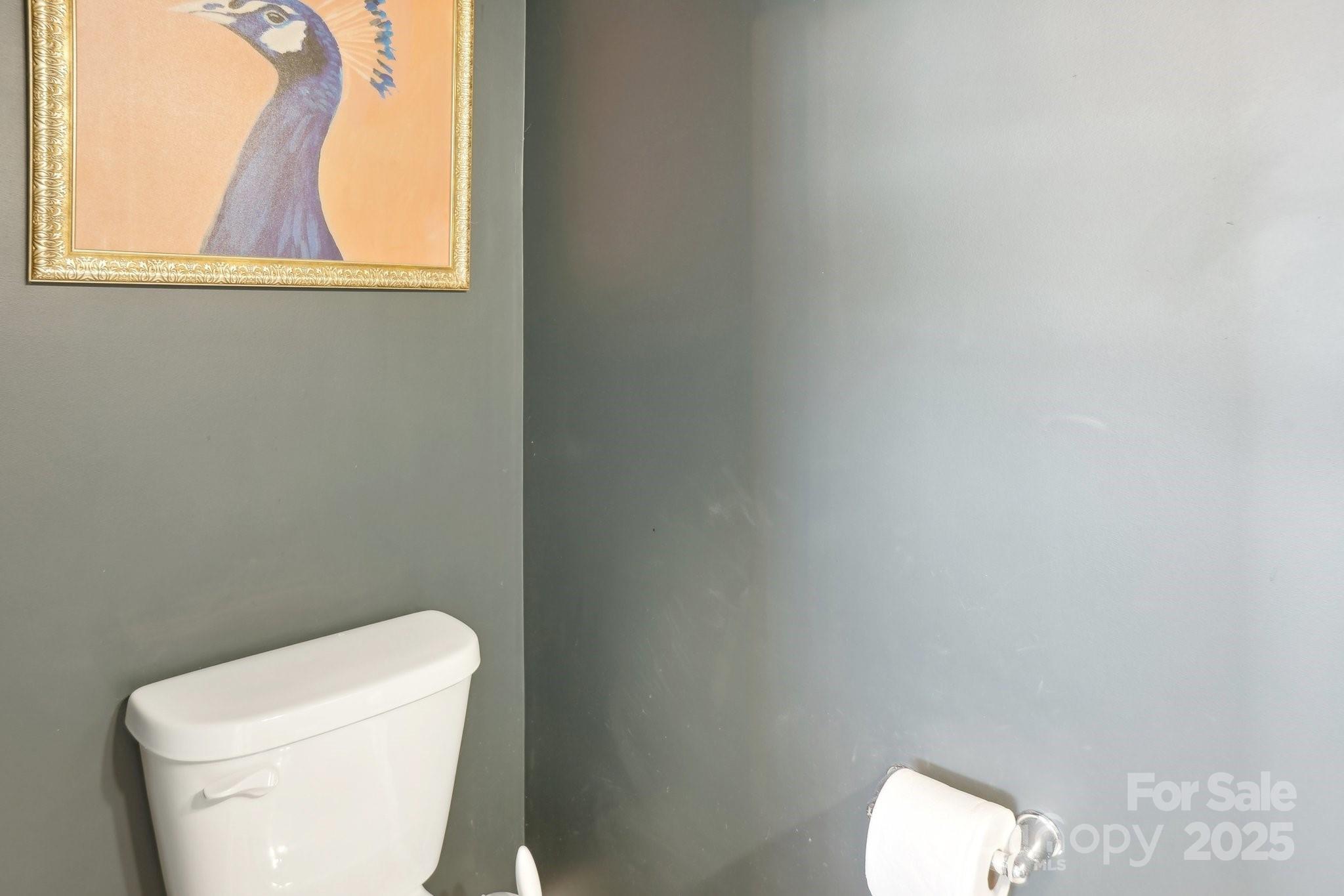 12461 Bryton Ridge Parkway Huntersville, NC 28078 - Photo 13 of 33 a white toilet sitting next to a window