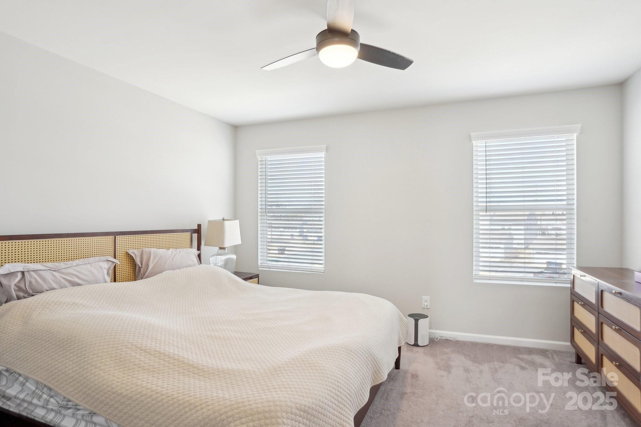 12461 Bryton Ridge Parkway Huntersville, NC 28078 - Photo 14 of 33 a bedroom with a bed and a window