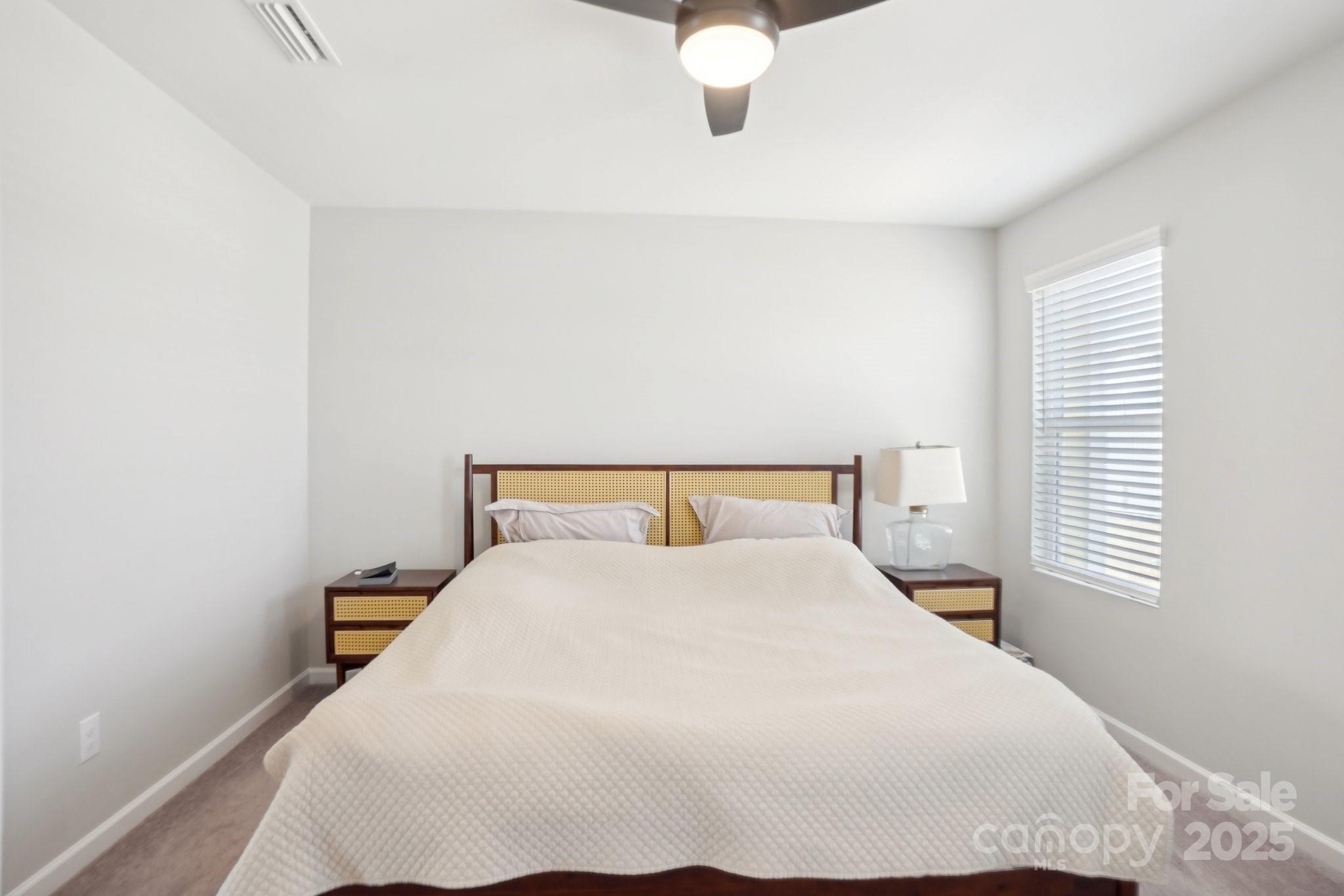 12461 Bryton Ridge Parkway Huntersville, NC 28078 - Photo 15 of 33 a large white bed in a small room
