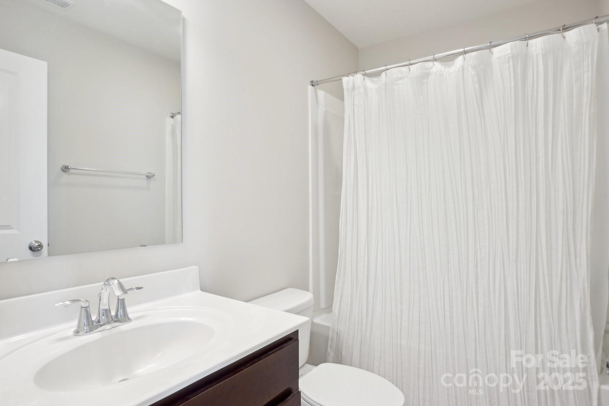 12461 Bryton Ridge Parkway Huntersville, NC 28078 - Photo 20 of 33 a bathroom with a sink and a mirror