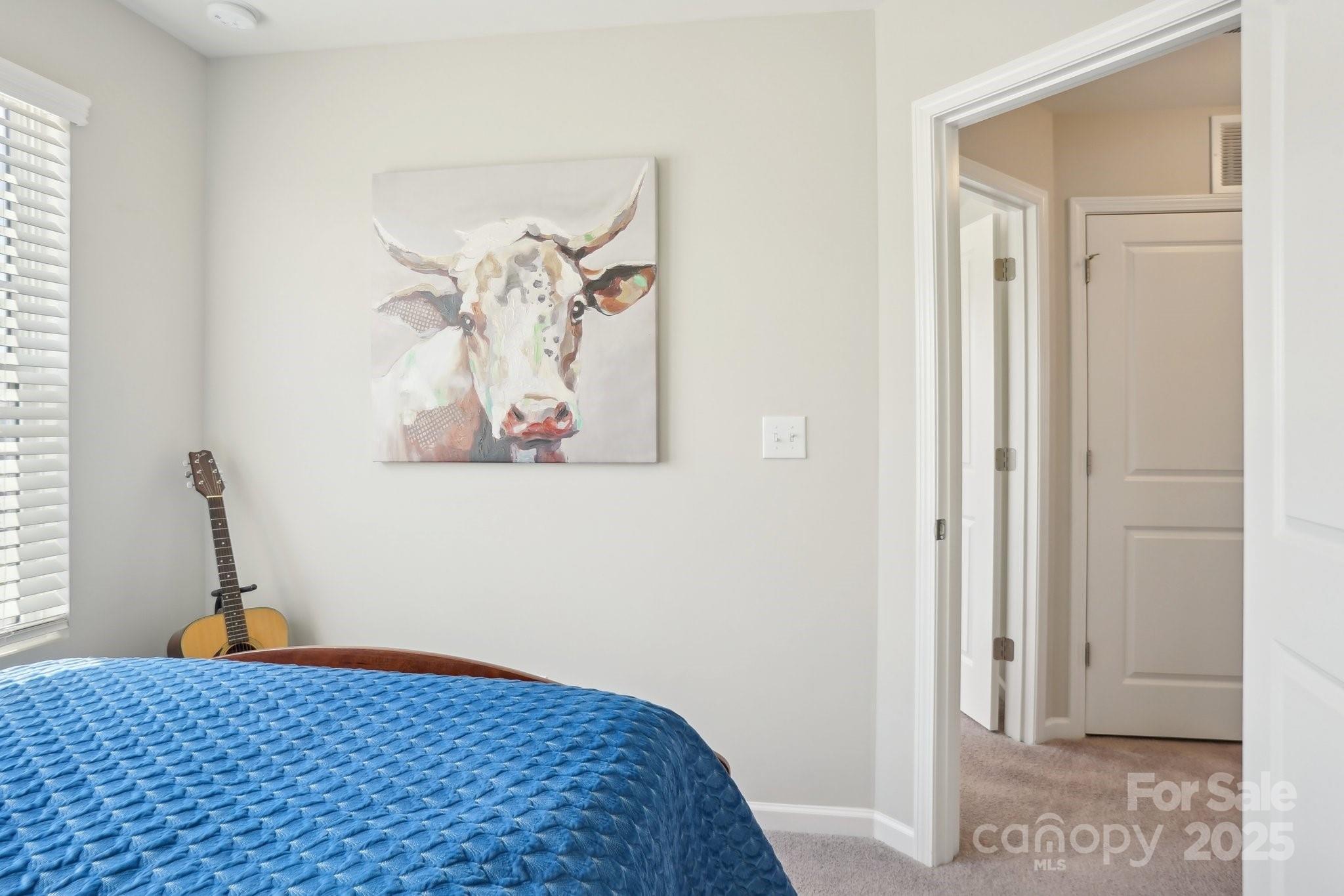 12461 Bryton Ridge Parkway Huntersville, NC 28078 - Photo 22 of 33 a bedroom with a bed and a window