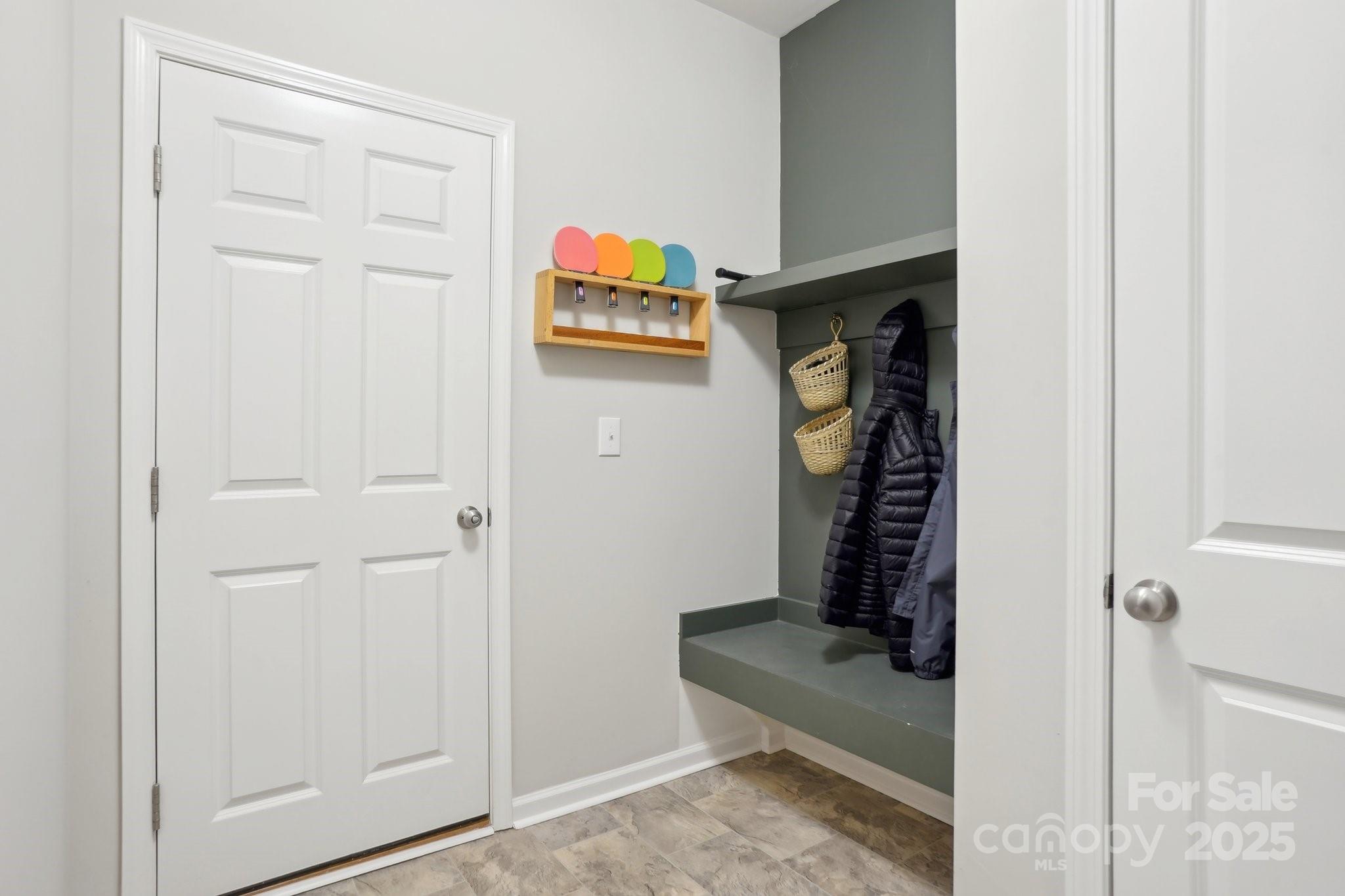 12461 Bryton Ridge Parkway Huntersville, NC 28078 - Photo 28 of 33 a view of a hallway with paintings on the wall