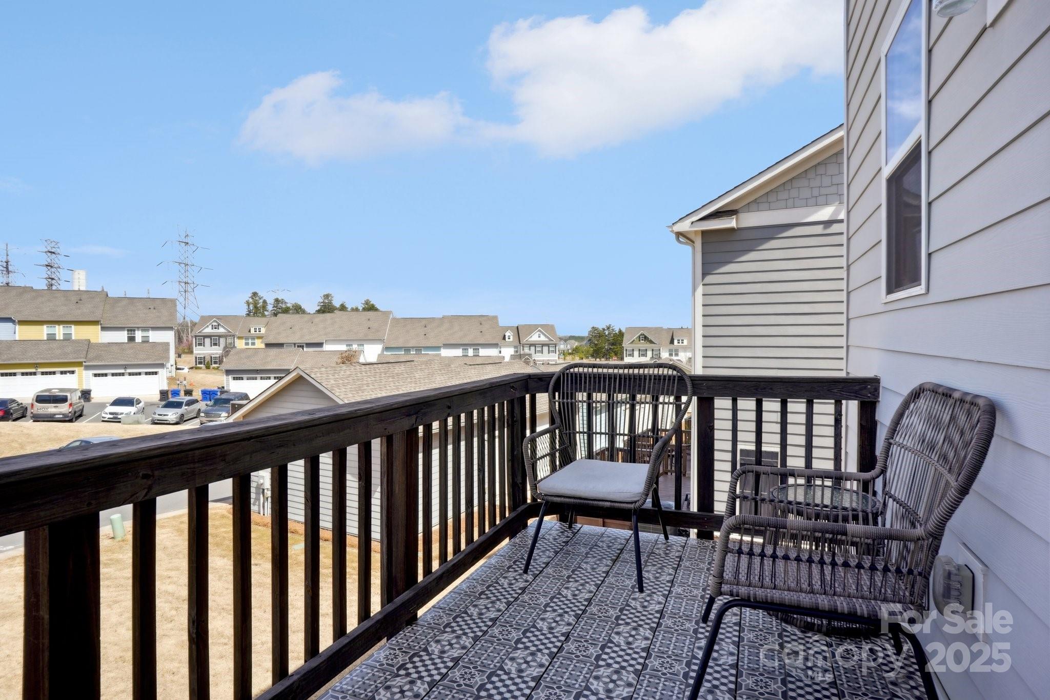 12461 Bryton Ridge Parkway Huntersville, NC 28078 - Photo 30 of 33 a view of a roof deck with table and chairs
