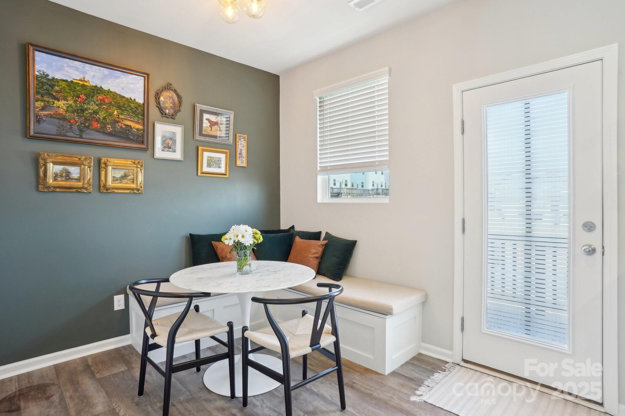 12461 Bryton Ridge Parkway Huntersville, NC 28078 - Photo 8 of 33 a view of a dining room with furniture and wooden floor