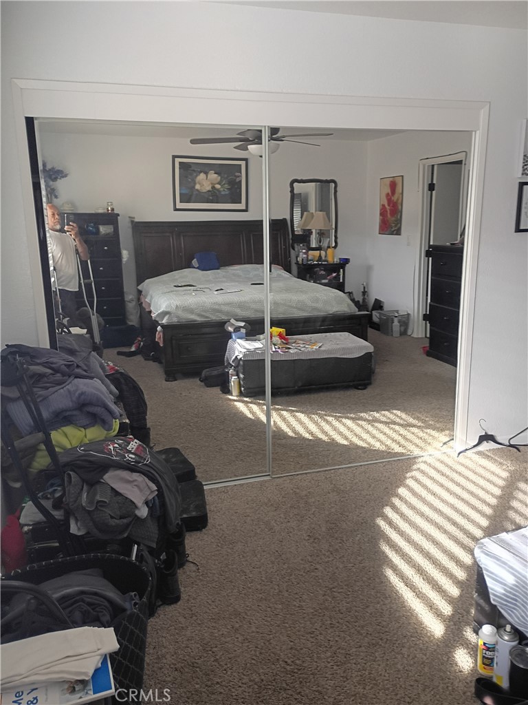 201 South Greenlawn Street Ridgecrest, CA 93555 - Photo 11 of 31 a bedroom with a bed and a mirror