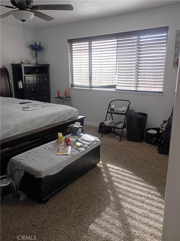 201 South Greenlawn Street Ridgecrest, CA 93555 - Photo 15 of 31 a living room with furniture and a window