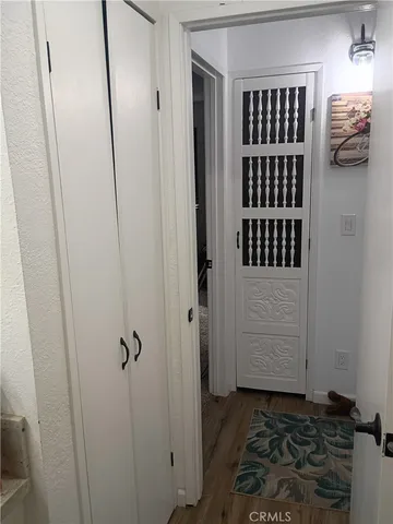 a white toilet sitting next to a sink