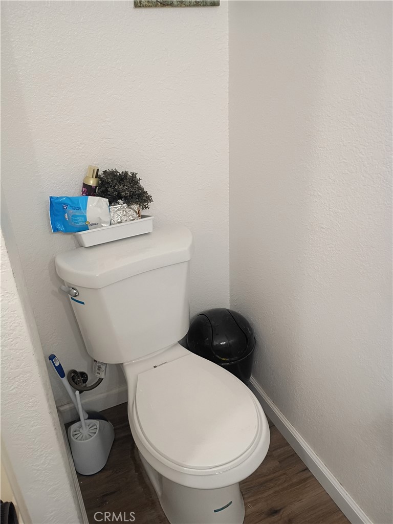 201 South Greenlawn Street Ridgecrest, CA 93555 - Photo 17 of 31 a white toilet sitting next to a sink