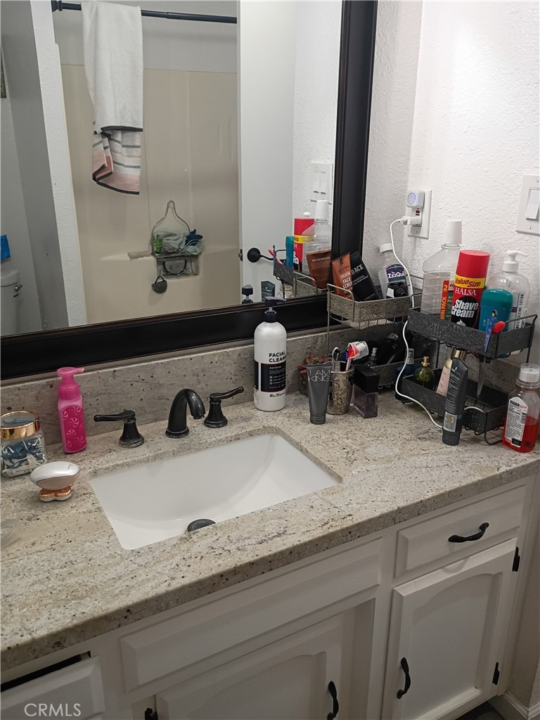 201 South Greenlawn Street Ridgecrest, CA 93555 - Photo 18 of 31 a bathroom with sink and mirror