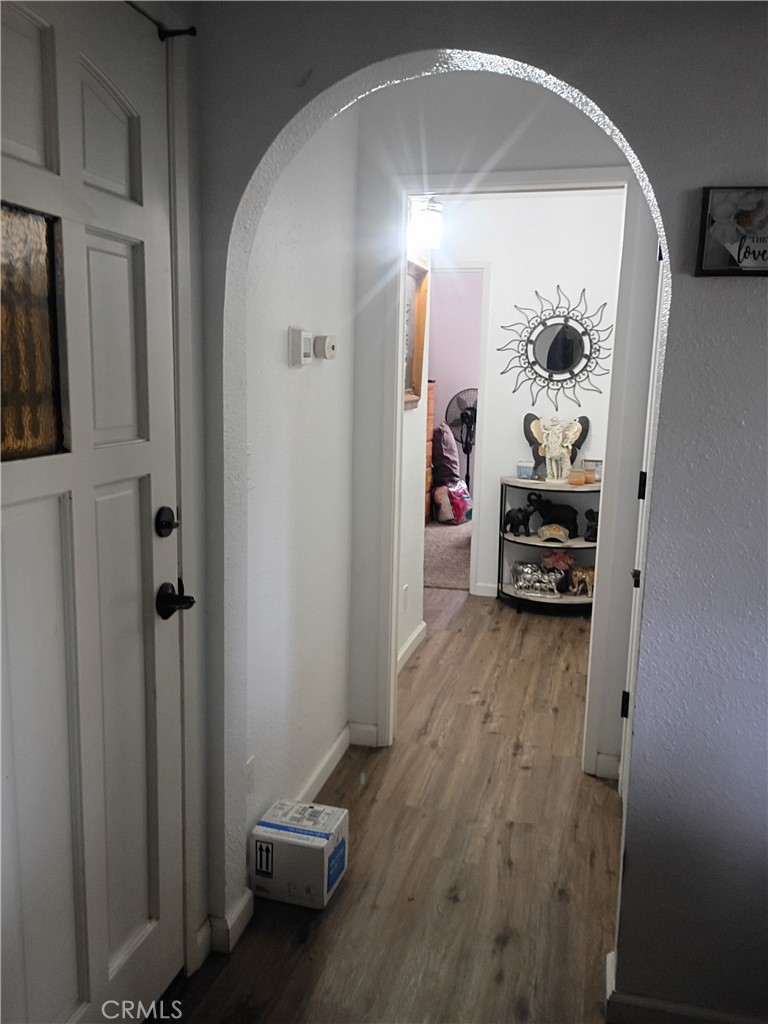 201 South Greenlawn Street Ridgecrest, CA 93555 - Photo 24 of 31 a view of a livingroom with wooden floor and furniture