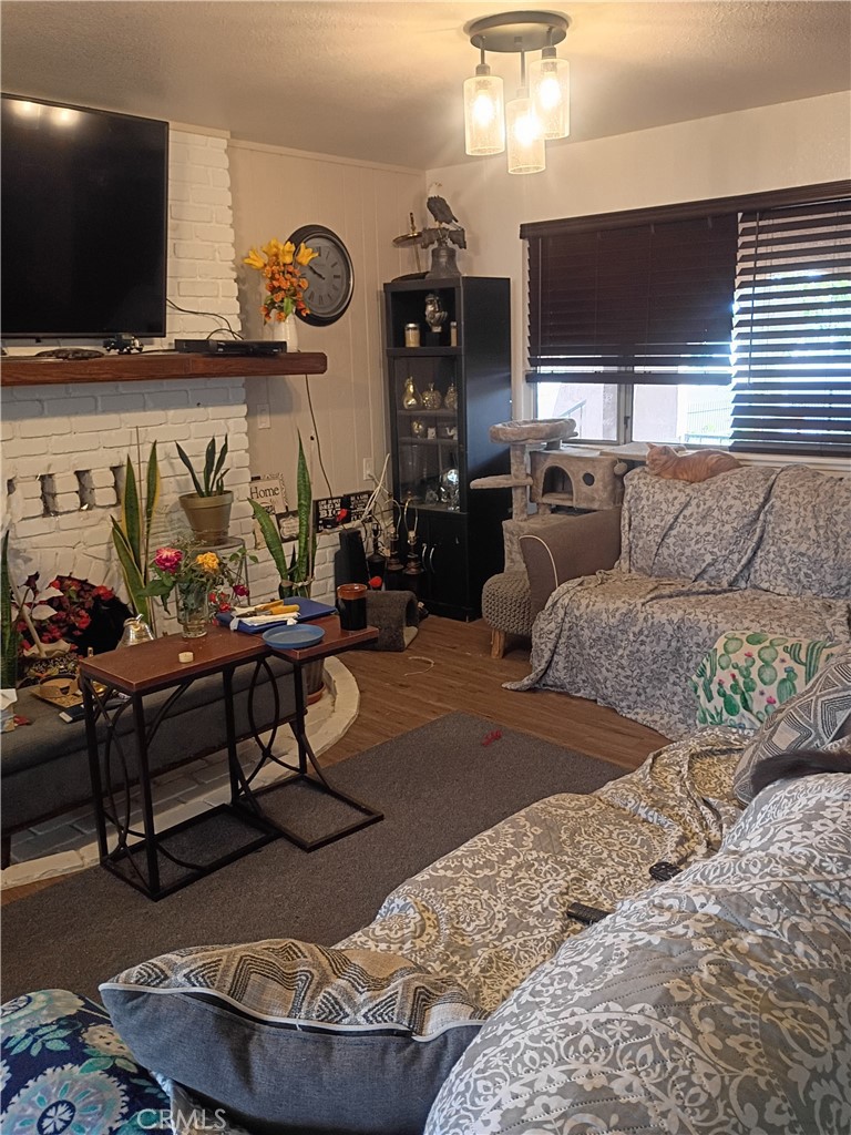 201 South Greenlawn Street Ridgecrest, CA 93555 - Photo 25 of 31 a living room with furniture and a flat screen tv