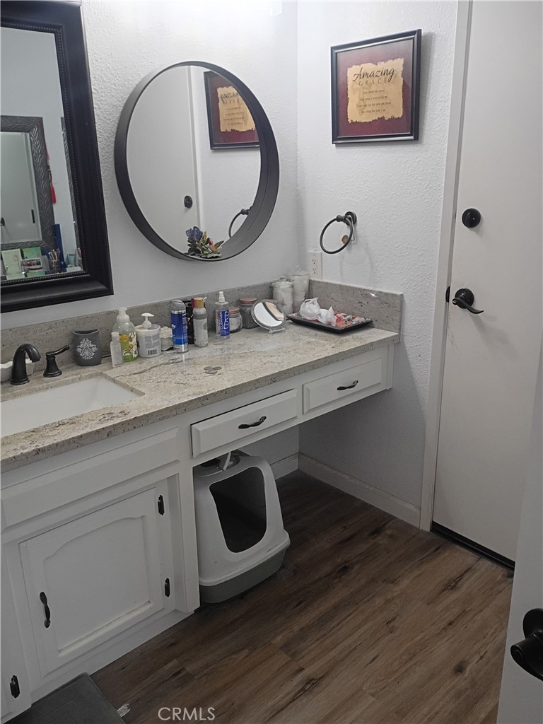 201 South Greenlawn Street Ridgecrest, CA 93555 - Photo 9 of 31 a bathroom with a sink and a mirror