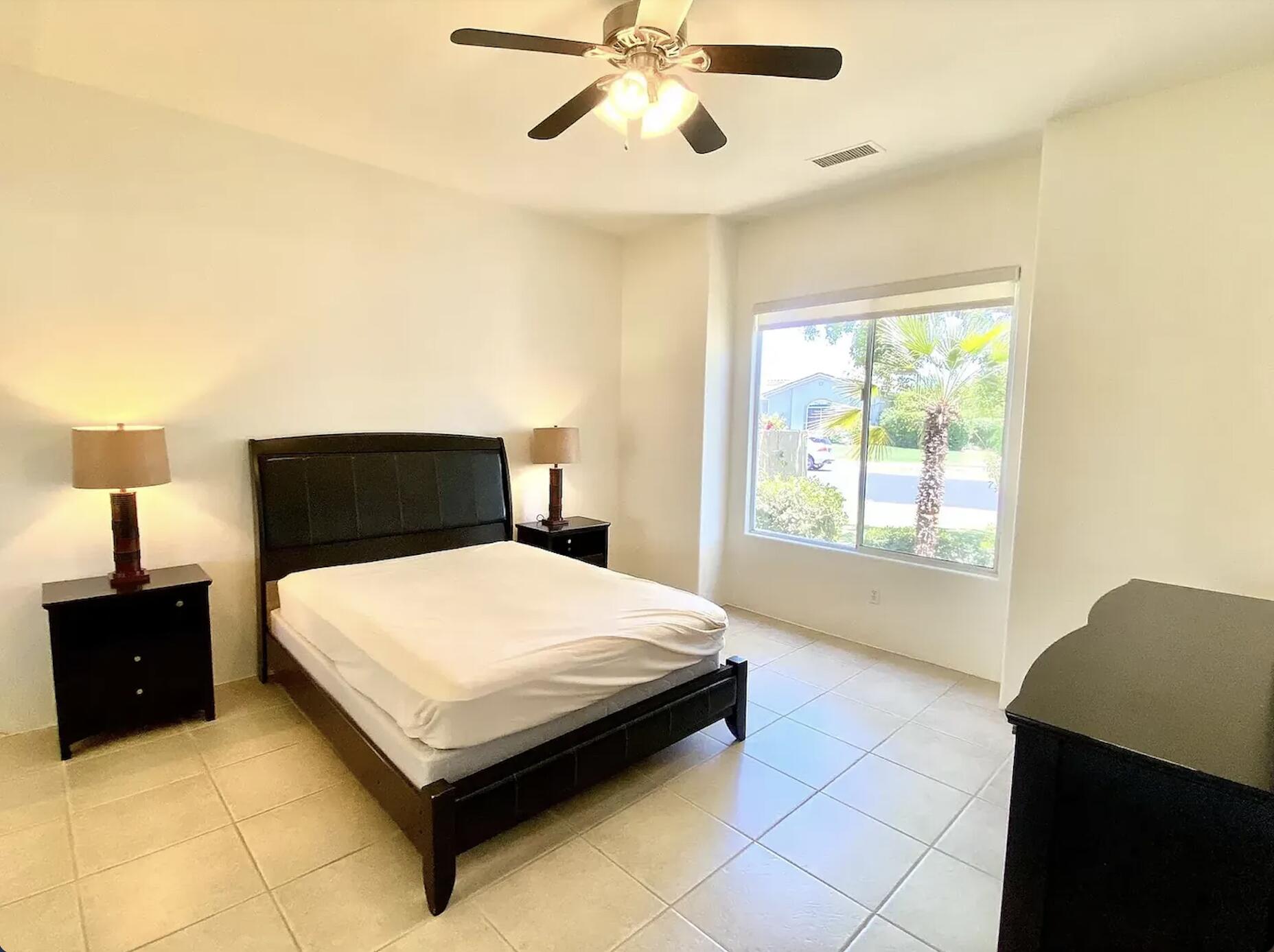 5 Victoria Falls Drive Rancho Mirage, CA 92270 - Photo 21 of 26 a bedroom with a bed and window
