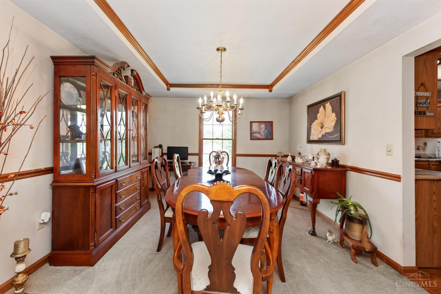 6361 Sharps Ridge Court Hamilton, OH 45011 - Photo 5 of 32 Formal dining room with trey ceiling, chair rail and chandelier
