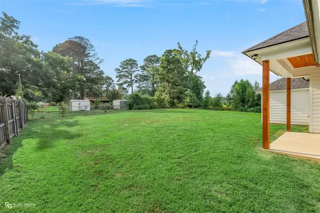 a backyard of a house with lots of green space