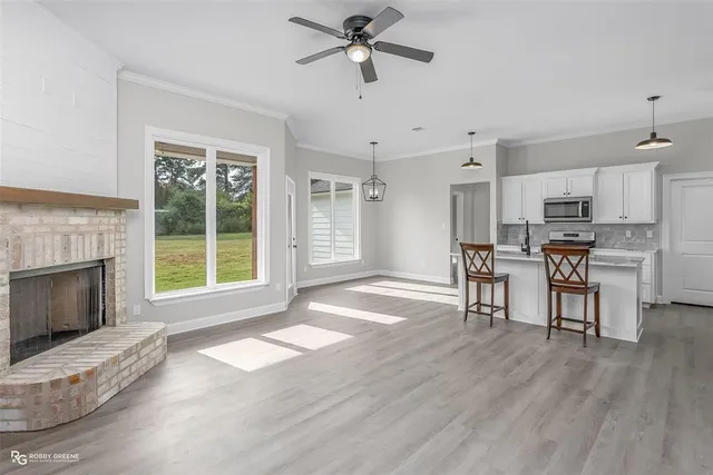 a view of a livingroom with furniture and a fireplace