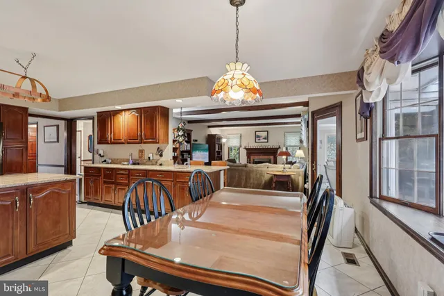 a kitchen with stainless steel appliances granite countertop a sink refrigerator stove and microwave