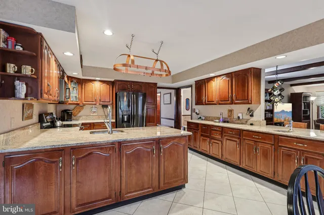 a living room with furniture a table and a large window