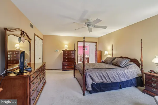 a bed room with a bed and a painting