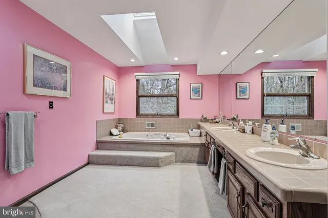a bathroom with a sink double vanity and a toilet
