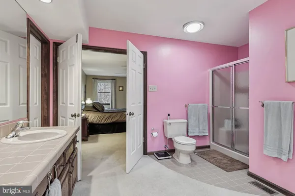 a room with pool table and a chandelier