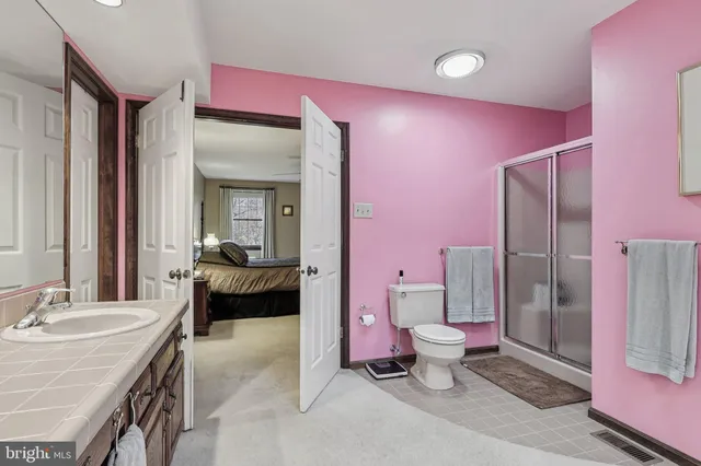 a room with pool table and a chandelier