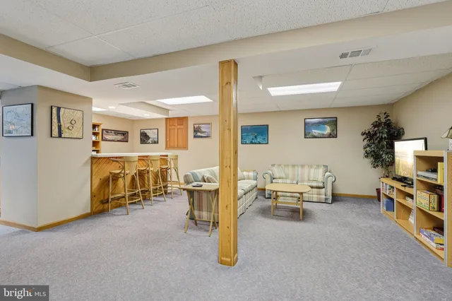 a view of a roof deck with table and chairs floor to ceiling window with wooden floor