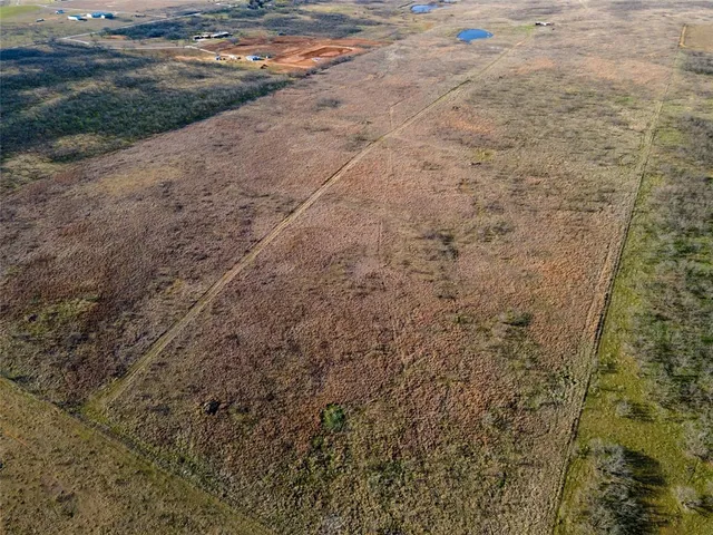 a view of a dry yard with wooden floor