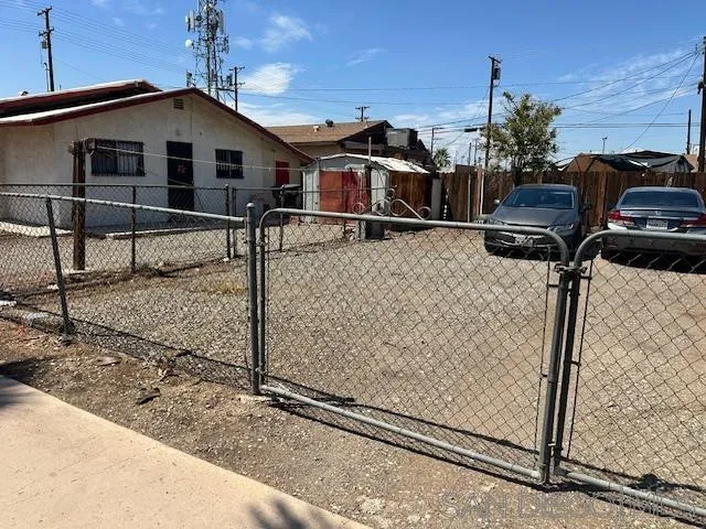 21 East 7th Street, Unit 1 Calexico, CA 92231 - Photo 2 of 4 a view of a house with a wooden fence