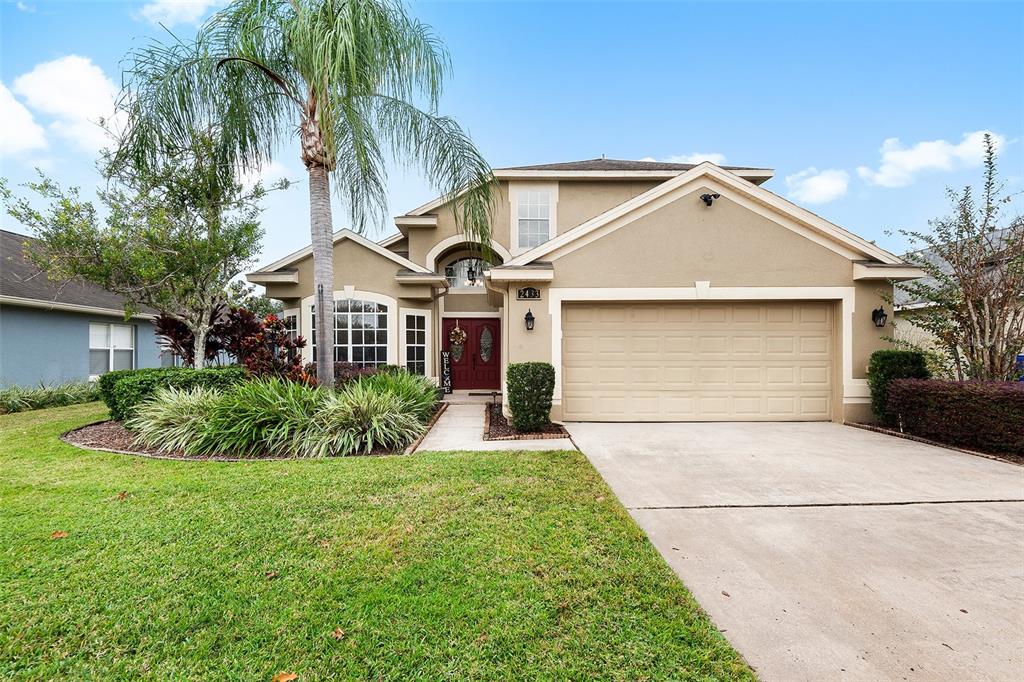 2433 Quiet Waters Loop Ocoee, FL 34761 - Photo 1 of 1 a front view of a house with a yard and garage
