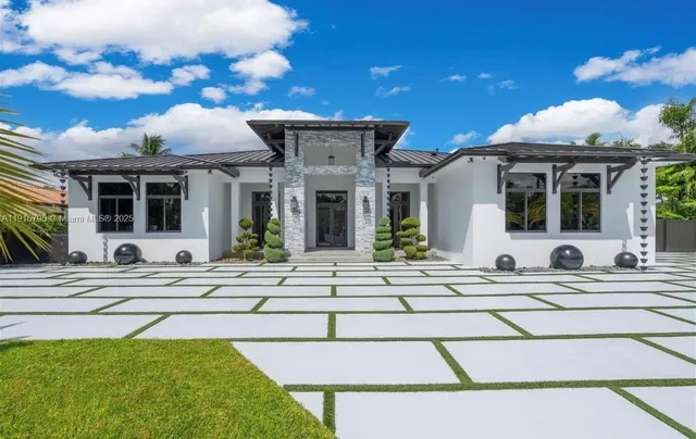 a view of a house with sitting area and furniture