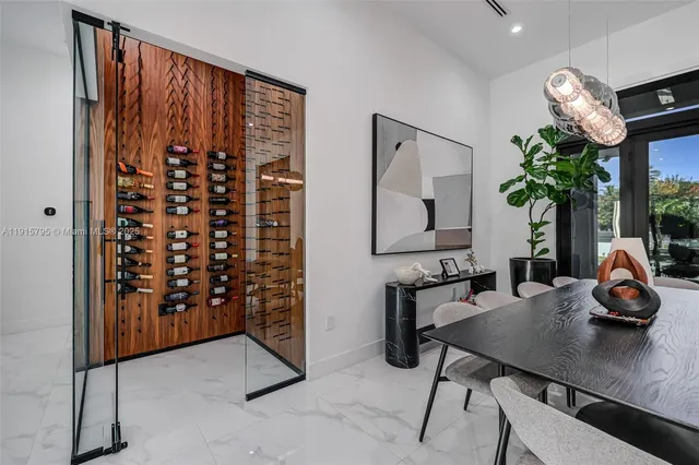 a living room with patio furniture and a large window