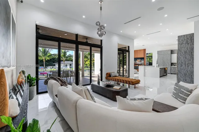 a kitchen with stainless steel appliances a sink stove and cabinets