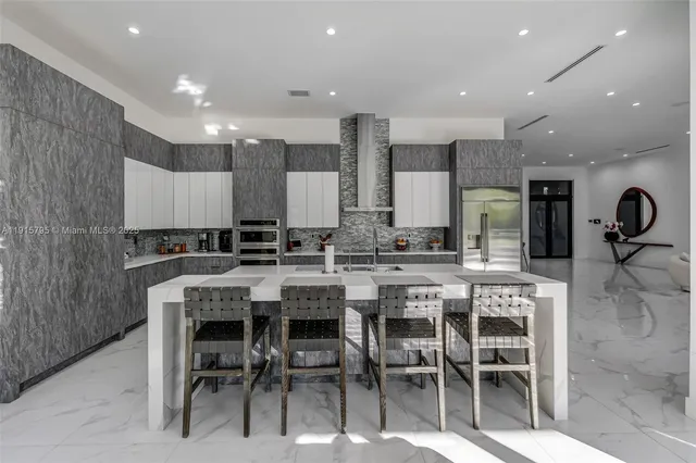 a living room with furniture ceiling fan and a window