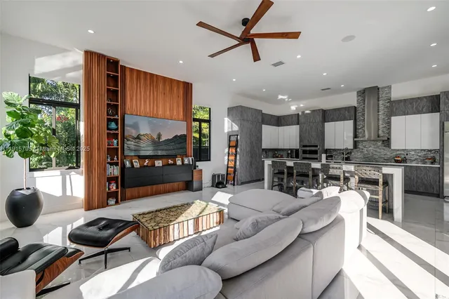 a bathroom with a granite countertop toilet sink and mirror